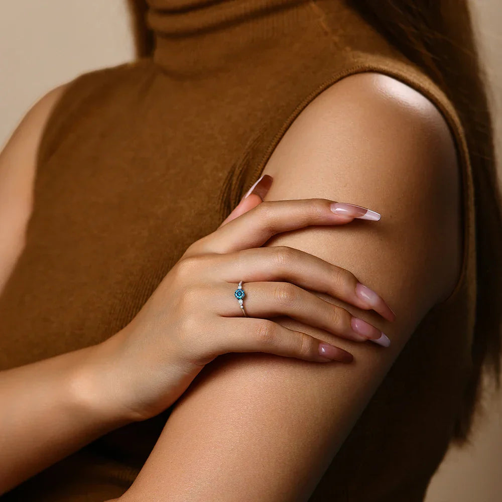 18k Gold Solitaire Ring with Blue Moissanite